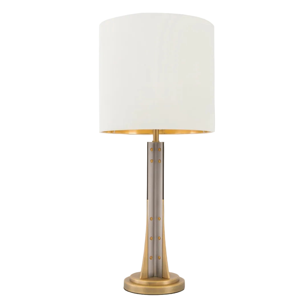 A sleek table lamp with a pale gunmetal and antique brass finish, featuring a white shade, designed for understated elegance.