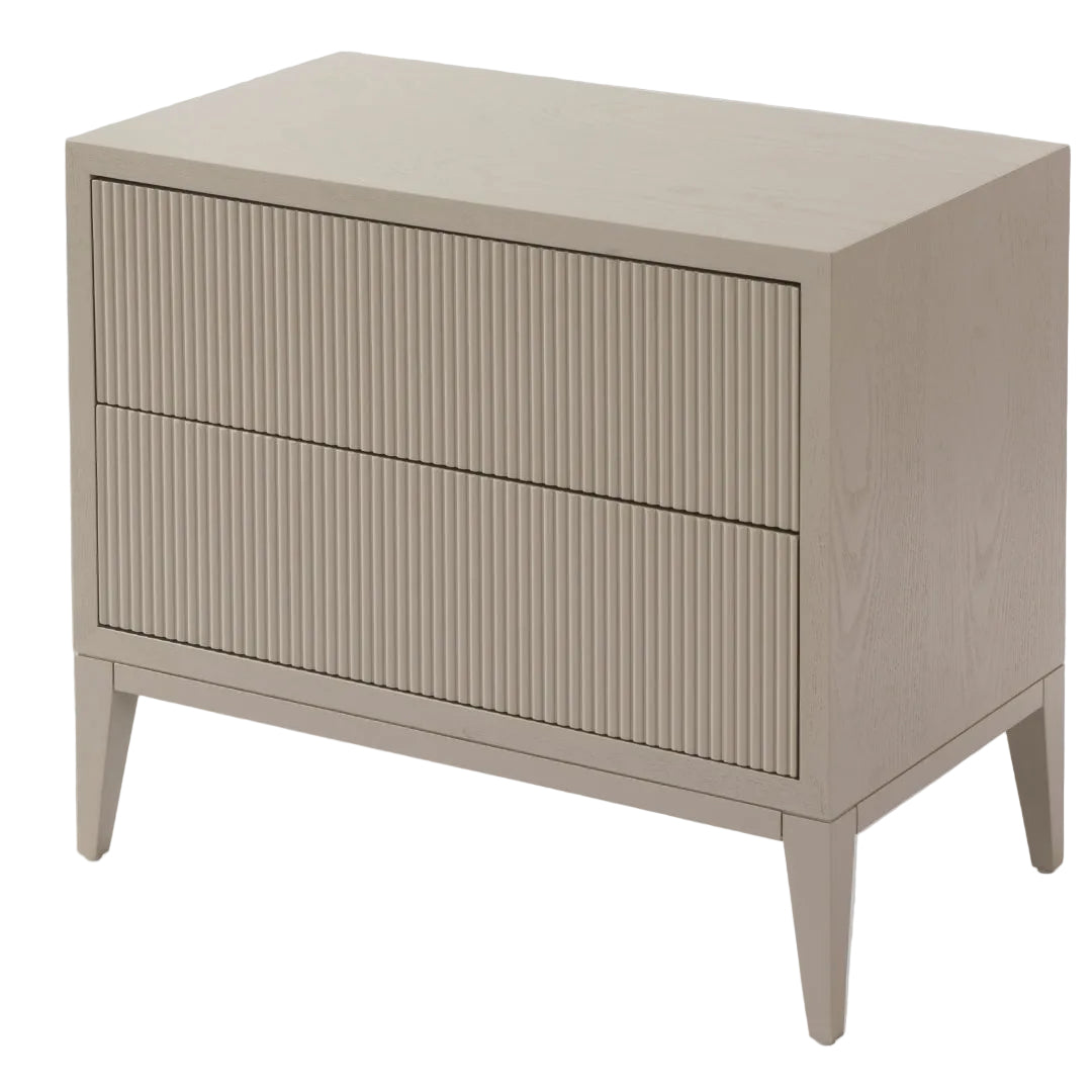A sleek ceramic grey bedside table with three wide drawers and tapered legs, designed in a modern style.