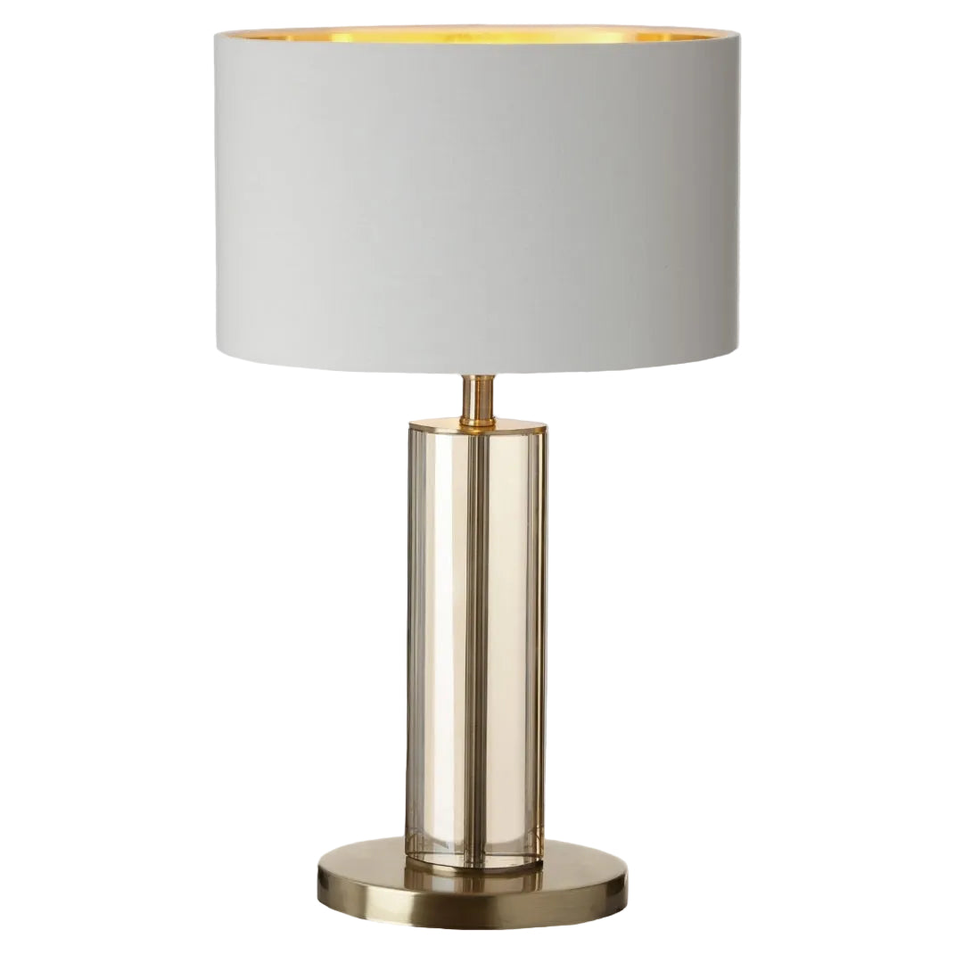 A Birch Table Lamp with an antique brass and cognac base, paired with a classic opal fabric shade.