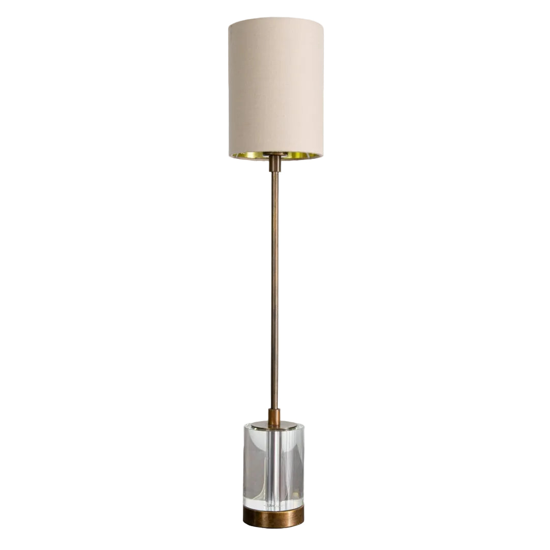 A Cyrus H60cm Table Lamp with antique brass finish, crystal accent, and soft latte fabric shade.