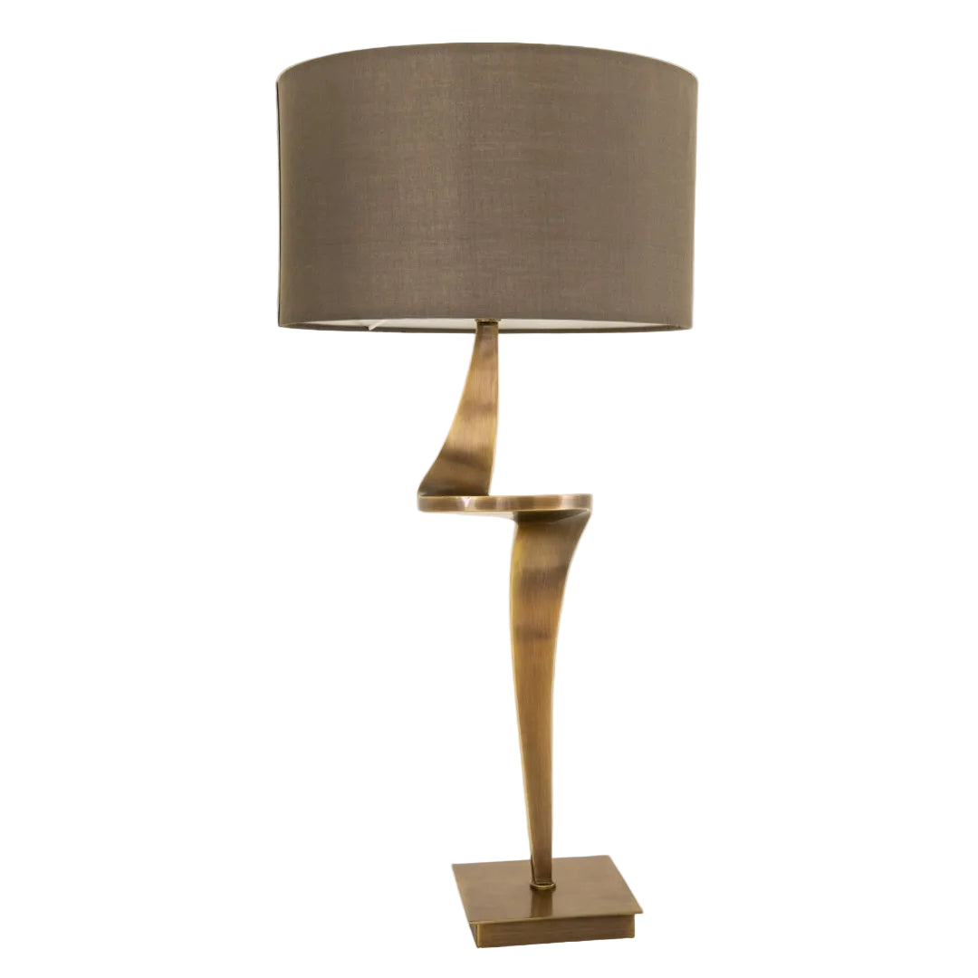 An elegant Nero Table Lamp with a unique swirl base in antique brass finish and a brown fabric shade.