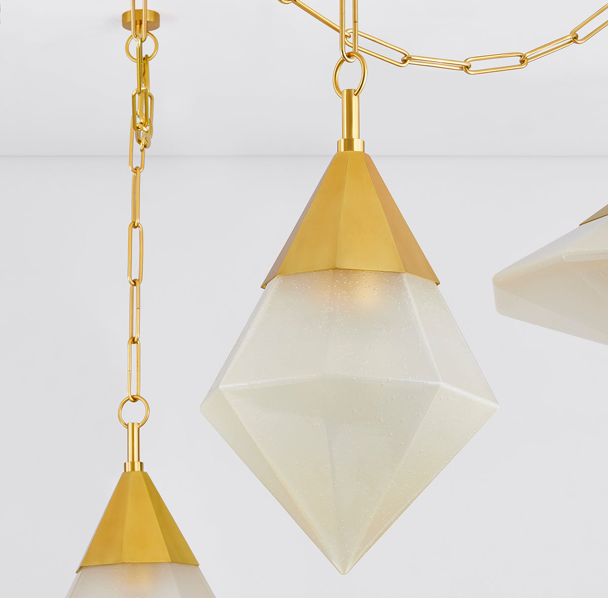 Angelique 5-Light Linear Pendant – Vintage Polished Brass with Champagne Seeded Glass