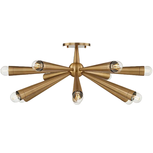 A modern six-light semi-flush mount ceiling light fixture in a brushed brass finish with clear glass shades, shown against a solid white background.