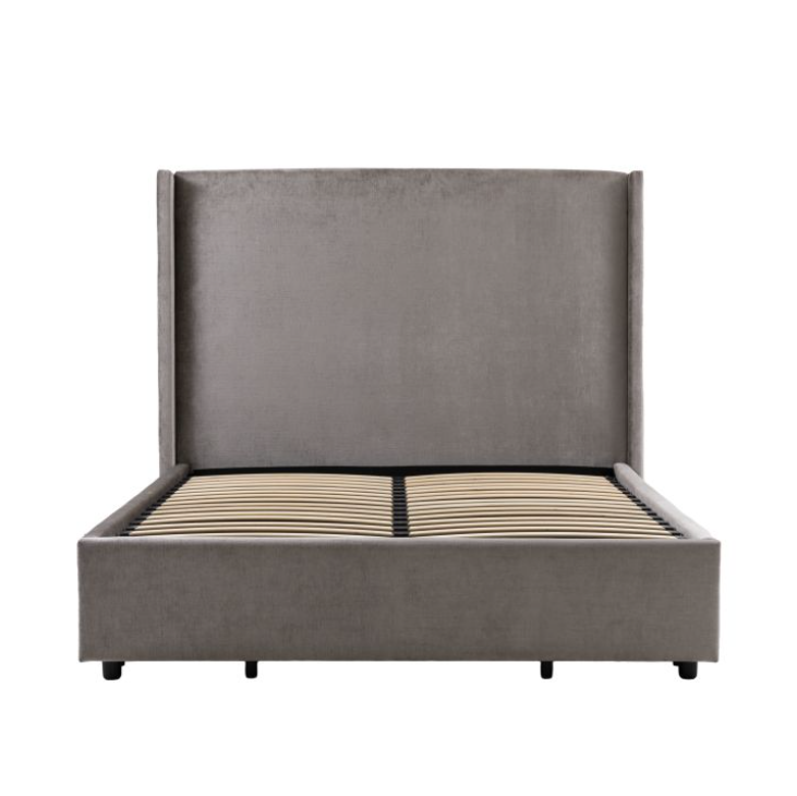 Gray upholstered bed with a white background