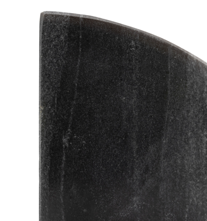 A close-up of a dark charcoal gray stone or ceramic tile with a curved profile against a solid white background.